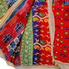 The Window, Milford Haven red and navy Kantha cotton kimono with wide sleeves, intricate quilting, and fringed trim.