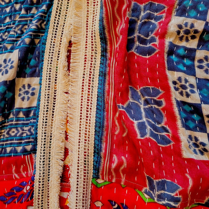 The Window, Milford Haven red and navy cotton Kantha kimono with wide sleeves and a detailed cream fringed border.