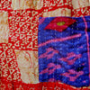 The Window, Milford Haven red and turquoise cotton Kantha overalls featuring intricate hand-stitched quilting detail.