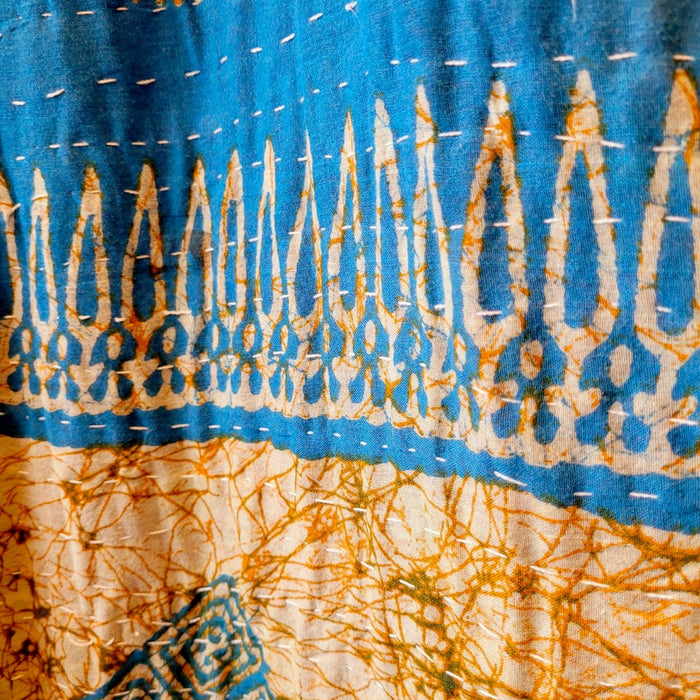 The Window, Milford Haven green and blue cotton Kantha overalls featuring traditional white hand-stitched quilting.
