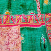 The Window, Milford Haven green and blue Kantha cotton oversized overalls with intricate patchwork and button detail.