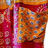 The Window, Milford Haven orange and red cotton Kantha overalls featuring intricate quilted patterns and a front pocket