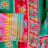 The Window, Milford Haven Kantha cotton overalls featuring vibrant green, red, and yellow patchwork quilting detail.