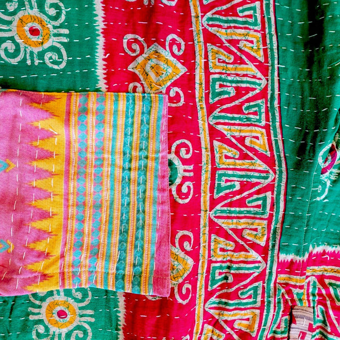 The Window, Milford Haven Kantha cotton overalls featuring vibrant green, red, and yellow patchwork quilting detail.