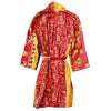 The Window, Milford Haven Kantha quilted cotton dressing gown in red and yellow with butterfly and geometric patterns.