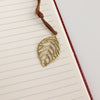 The Window, Milford Haven A5 notebook with lined pages, red leather-effect cover, and a brass-coloured leaf bookmark.