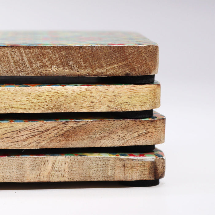 The Window, Milford Haven square mango wood coasters with colourful Mediterranean tile patterns stacked on a table.