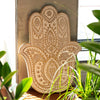The Window, Milford Haven whitewashed mango wood Hamsa wall plaque with intricate carved bohemian patterns.