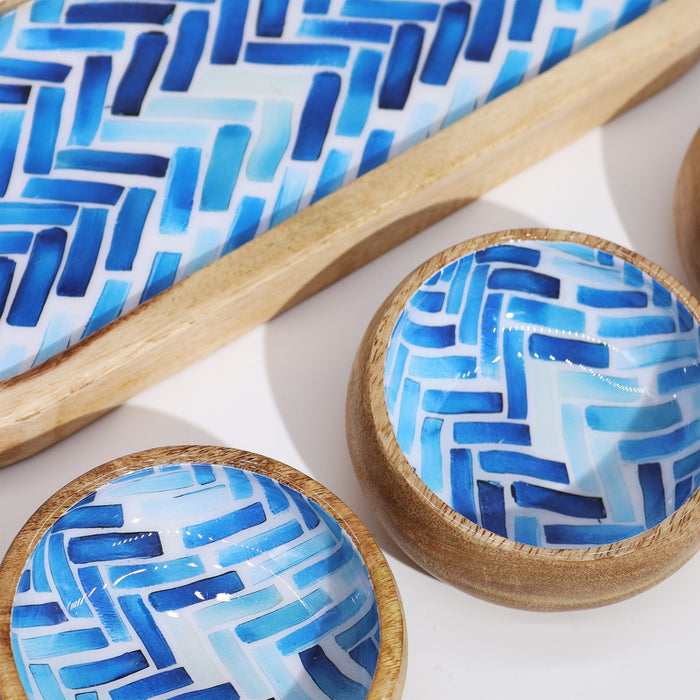 The Window, Milford Haven mango wood tray and bowls set featuring a blue herringbone stripe pattern on a white base.