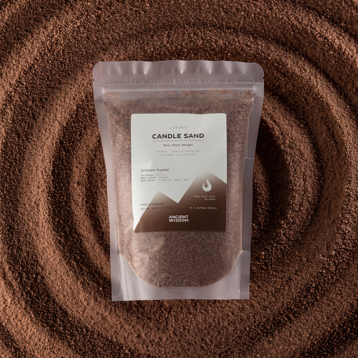 The Window, Milford Haven Crimson Crystal mocha brown candle sand in a 300g pouch surrounded by loose wax granules.