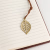 The Window, Milford Haven A5 notebook with lined pages and a decorative brass-coloured leaf bookmark on a cord.