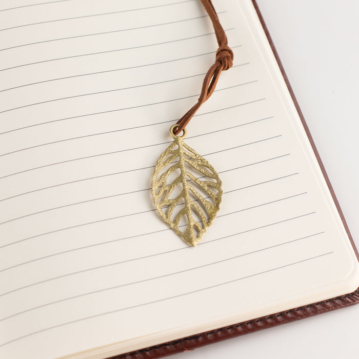 The Window, Milford Haven A5 notebook with lined pages and a decorative brass-coloured leaf bookmark on a cord.