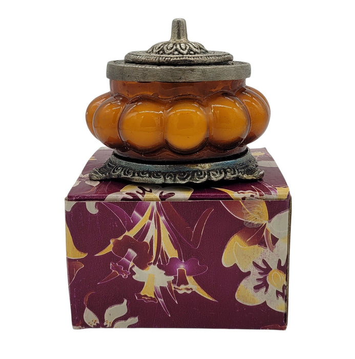 Song Of India Patchouli Amber scented candle in an orange pumpkin-shaped glass jar from The Window, Milford Haven.