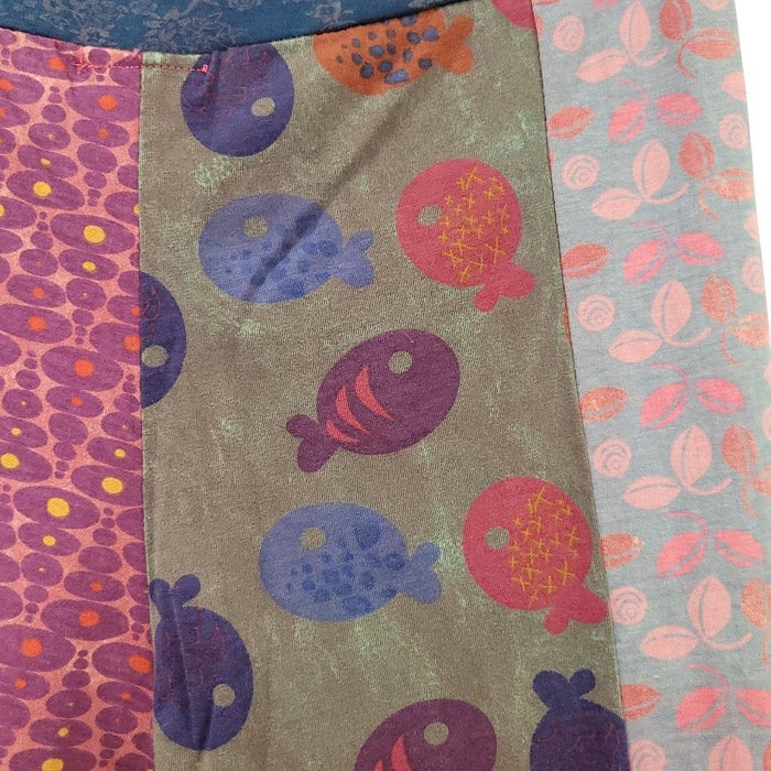 The Window, Milford Haven patchwork cotton flares featuring vibrant pink and blue fish and floral prints.