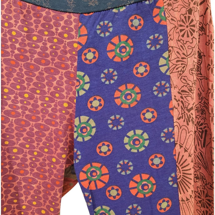 The Window, Milford Haven patchwork cotton flared trousers in vibrant pink and blue floral and geometric prints