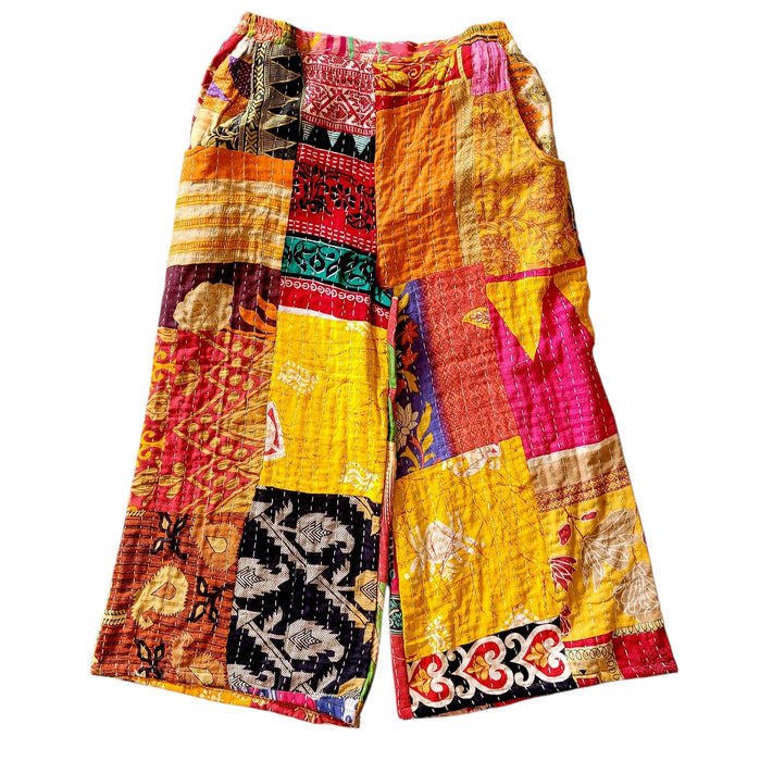 The Window, Milford Haven wide-leg Kantha trousers in vibrant patchwork cotton with a pink waistband and side pockets.