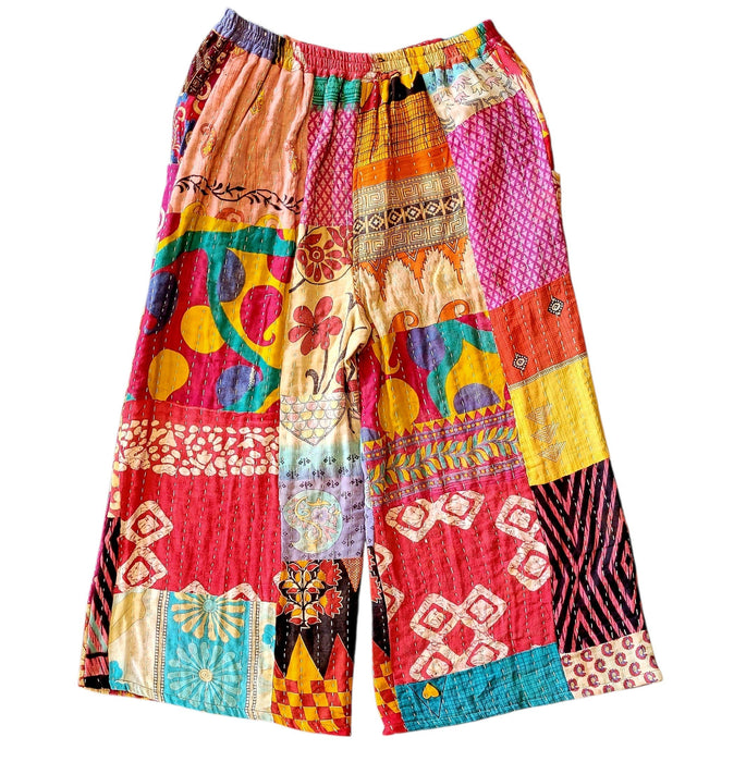 The Window, Milford Haven wide-leg Kantha trousers in multicoloured patchwork cotton with a beige elasticated waistband.
