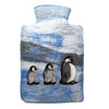 The Window, Milford Haven handmade wool felt hot water bottle cover featuring a blue snowy penguin family design.