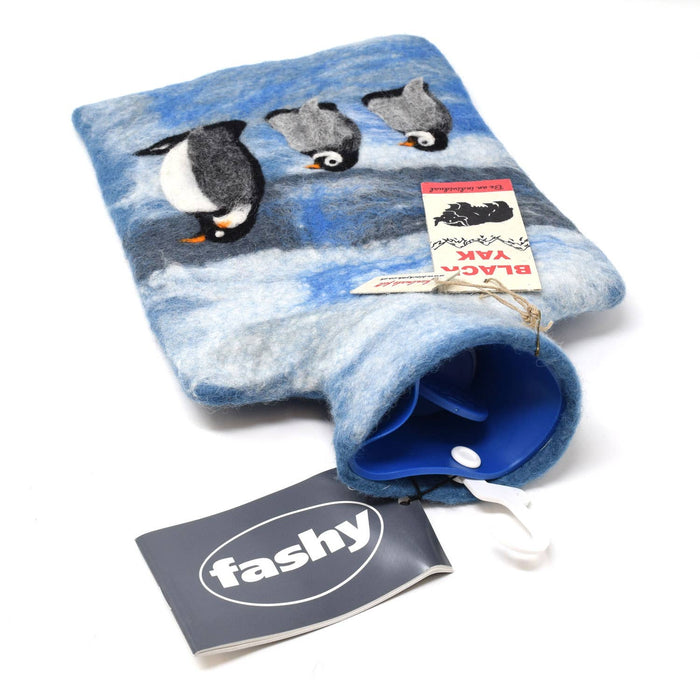 The Window, Milford Haven handmade blue wool felt hot water bottle cover featuring a cute penguin design.