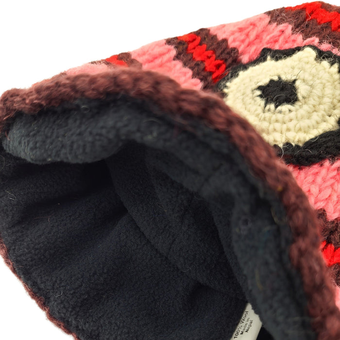 The Window, Milford Haven pink wool Minion beanie with black fleece lining, showing interior detail and knit texture.
