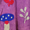 The Window, Milford Haven purple cotton tunic dress featuring vibrant embroidered toadstool and leaf motifs.