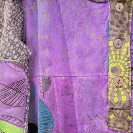 The Window, Milford Haven purple patchwork tunic dress with celestial moon and star prints and button detail.