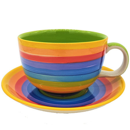The Window, Milford Haven giant ceramic breakfast cup and saucer with hand-painted bright rainbow stripes.