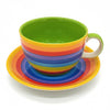 The Window, Milford Haven giant ceramic breakfast cup and saucer with bright hand-painted rainbow stripes.