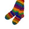 The Window, Milford Haven hand-knitted rainbow wool lounge socks with fleece lining and colourful patterned design.