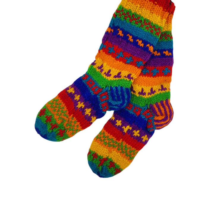 The Window, Milford Haven hand-knitted rainbow wool lounge socks with fleece lining and colourful patterned design.