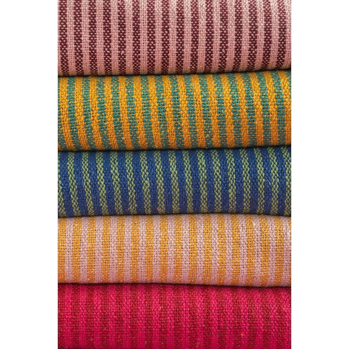 The Window, Milford Haven recycled cotton striped throws in various colours including pink, mustard, blue, and red.