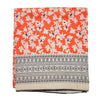 The Window, Milford Haven recycled sari scarf in vibrant orange with white floral print and geometric border pattern.