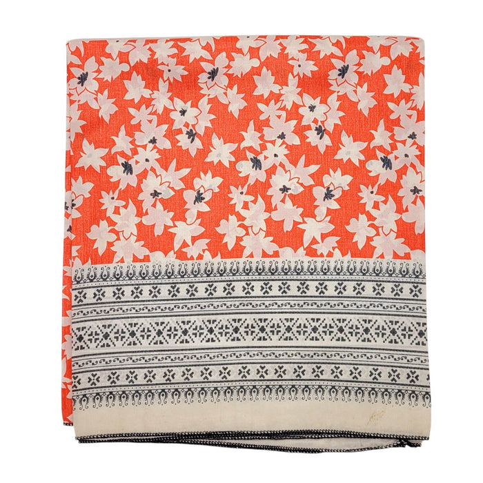 The Window, Milford Haven recycled sari scarf in vibrant orange with white floral print and geometric border pattern.