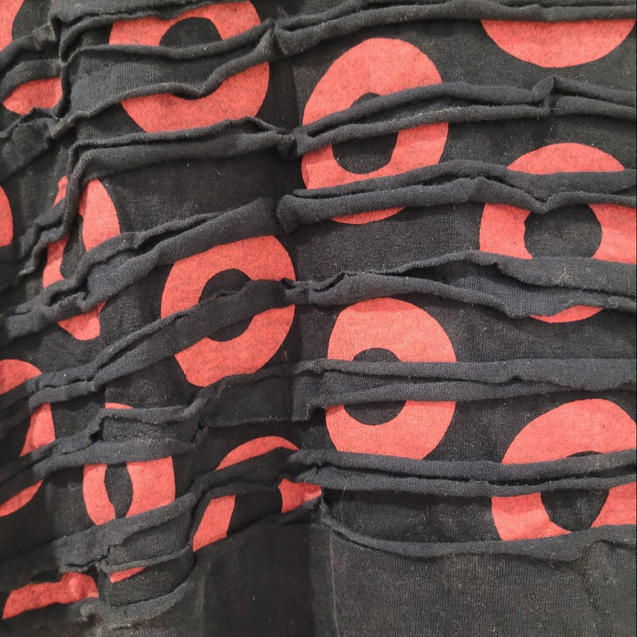 The Window, Milford Haven cotton tunic dress featuring a black and red circle print with textured raw seam detailing.