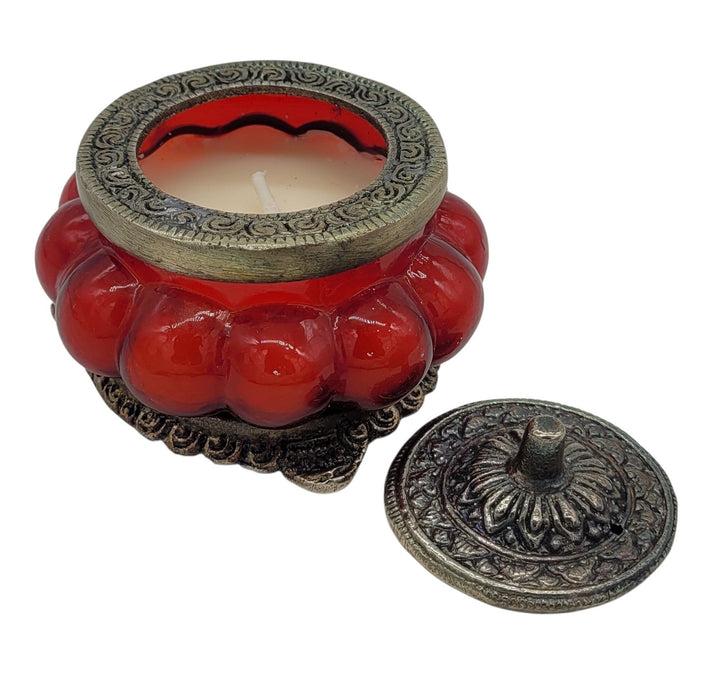 The Window, Milford Haven red rose scented soy candle in an antique-style pumpkin glass jar with ornate metal lid.
