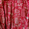 The Window, Milford Haven red cotton dressing gown featuring intricate white Kantha embroidery and bohemian patterns.