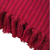 The Window, Milford Haven red and pink striped recycled cotton throw with textured knit and tasselled fringe detail.