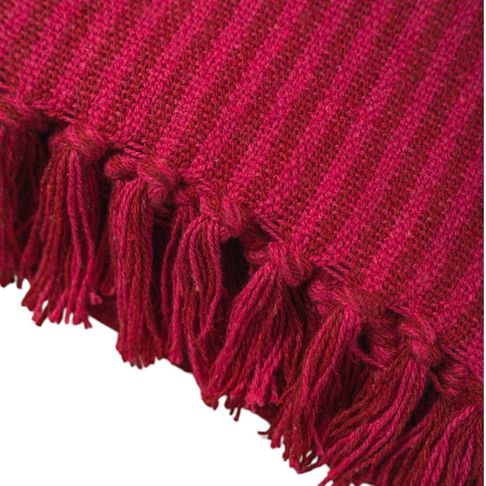 The Window, Milford Haven red and pink striped recycled cotton throw with textured knit and tasselled fringe detail.