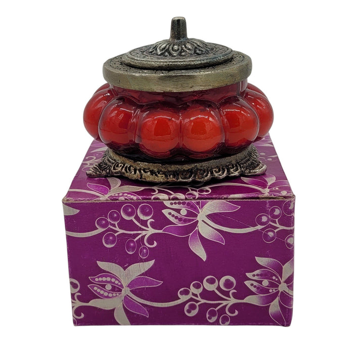The Window, Milford Haven Song Of India red rose scented soy candle in an antique pumpkin-shaped glass jar with lid.