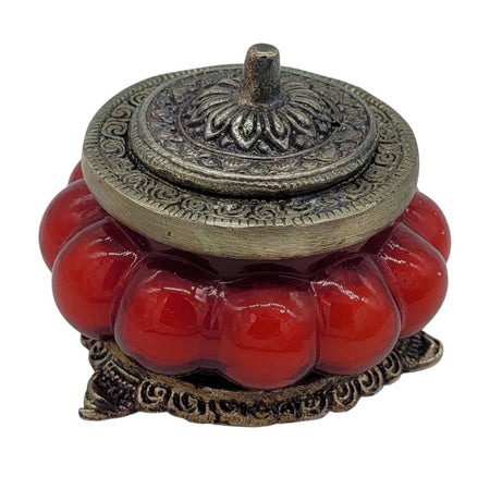The Window, Milford Haven red rose scented soy candle in an antique-style pumpkin glass jar with ornate metal lid.
