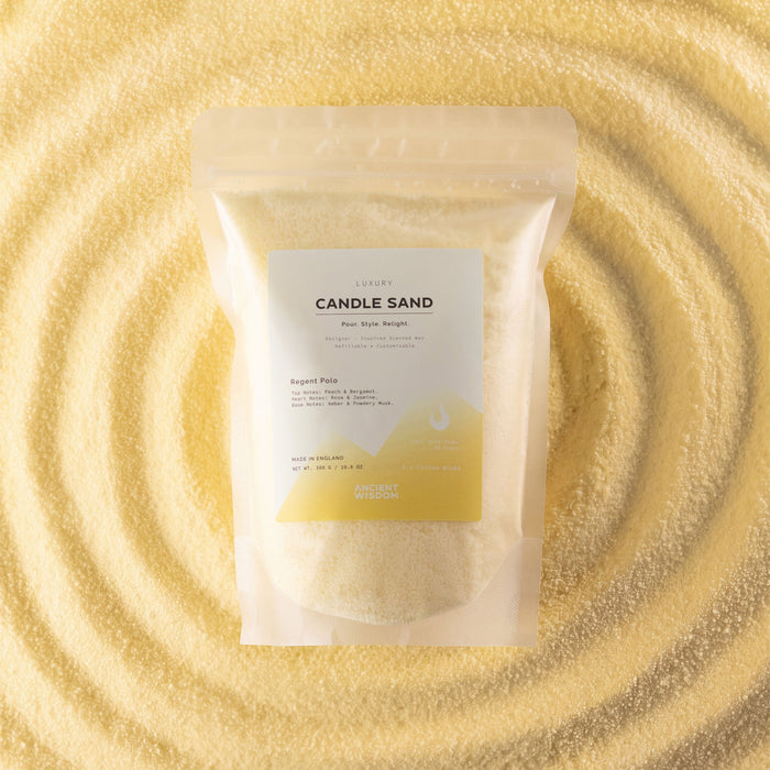 The Window, Milford Haven Regent Polo cream candle sand in a 300g pouch displayed on a bed of loose wax granules.