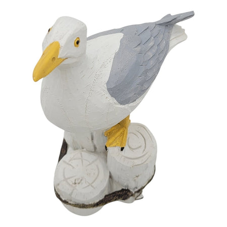The Window, Milford Haven resin seagull figurine perched on a wooden post with white and grey feathers and yellow beak