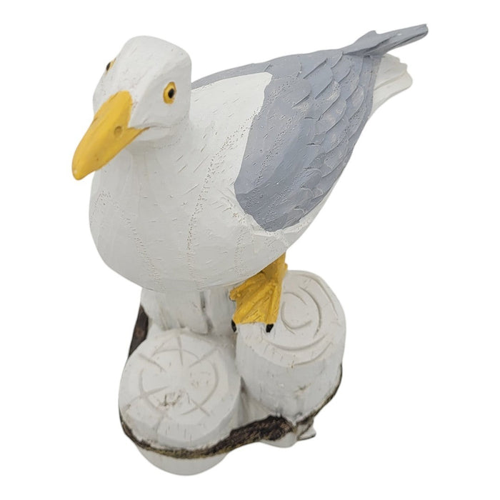 The Window, Milford Haven resin seagull figurine perched on a wooden post with white and grey feathers and yellow beak