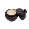 The Window, Milford Haven natural solid perfume in a hand-carved dark rosewood jar with a screw-top lid.