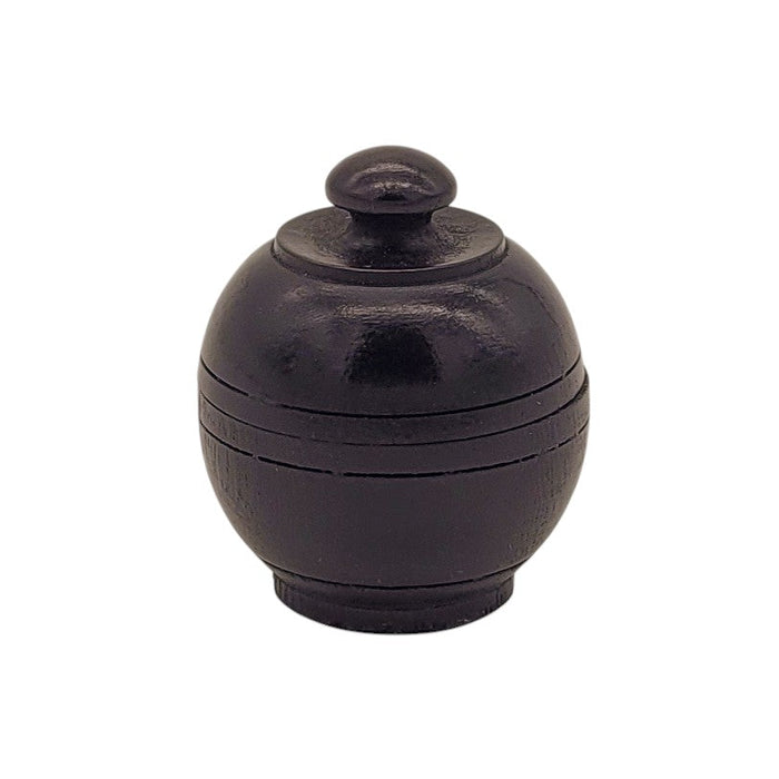 The Window, Milford Haven natural patchouli solid perfume in a hand-carved dark rosewood jar with a screw-top lid.