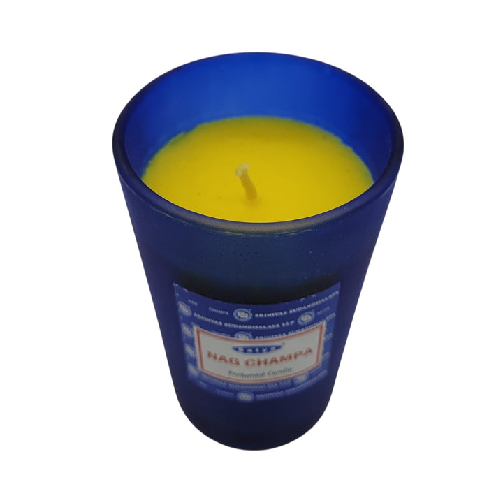 The Window, Milford Haven SATYA Nag Champa soy wax candle in a frosted blue glass jar with a yellow wax top.