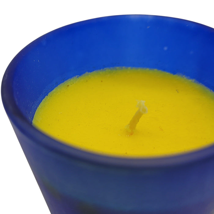 The Window, Milford Haven SATYA Nag Champa soy wax candle in a frosted blue glass jar with a yellow wax top