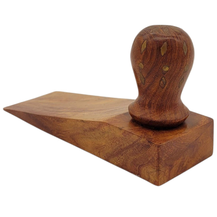 The Window, Milford Haven Song Of India wooden door stopper featuring decorative brass inlay on a sheesham wood handle.