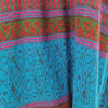 The Window, Milford Haven viscose maxi shirt dress featuring a vibrant turquoise and pink tapestry-style pattern.
