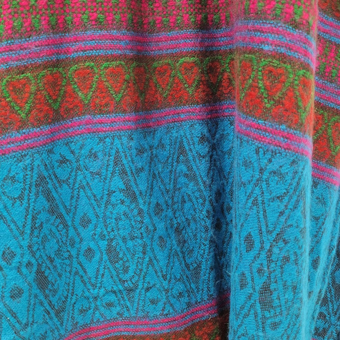The Window, Milford Haven viscose maxi shirt dress featuring a vibrant turquoise and pink tapestry-style pattern.